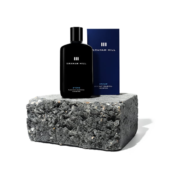 Stowe Vegan Charcoal Shampoo with box on granite slab