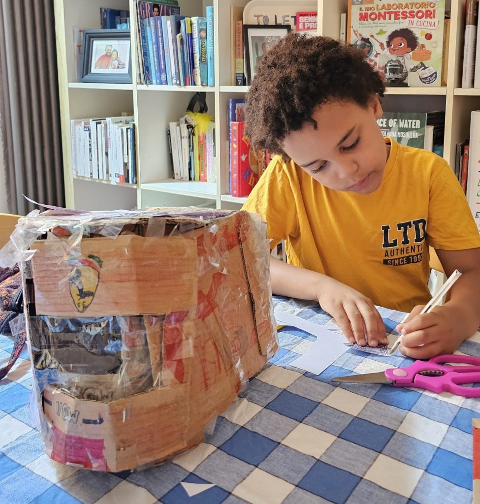 Noah working on his F1 crash helmet replica made from card