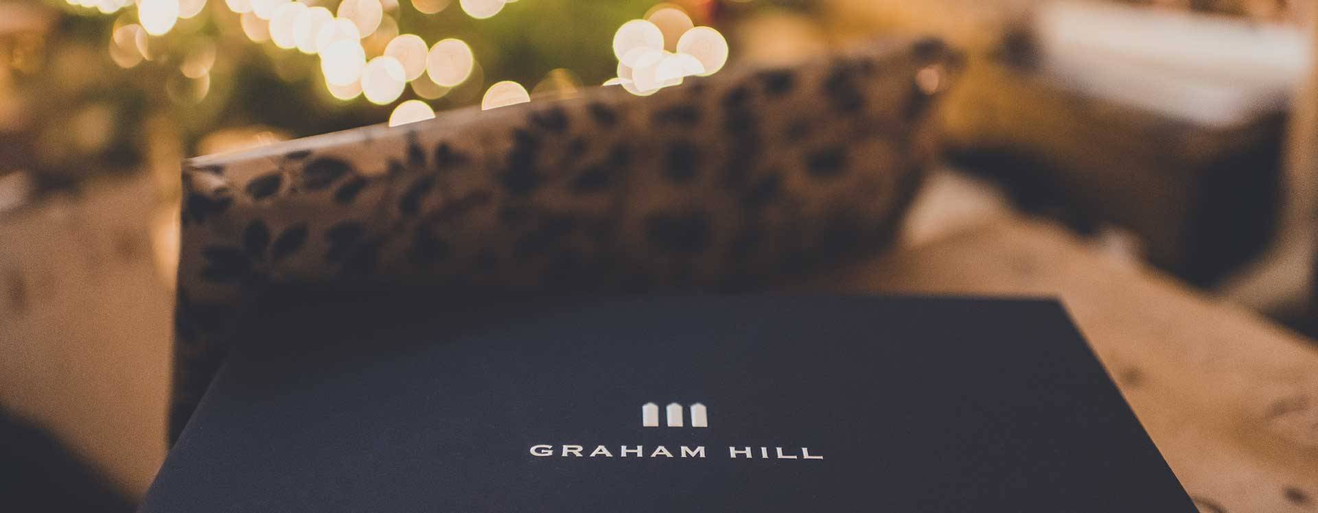 Graham Hill gift box unwrapped and sitting near tree